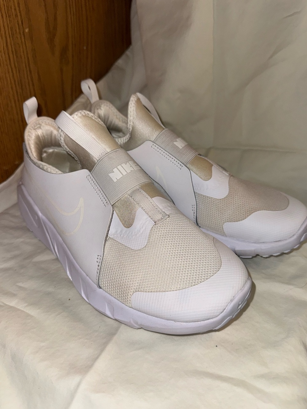 Nike Kids Slip-On Sneakers in White and Cream